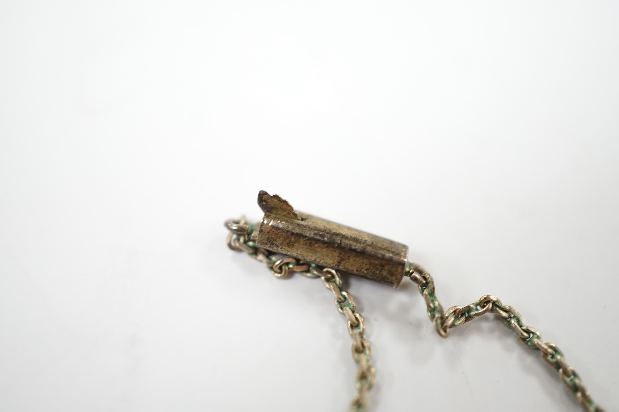 A white metal and garnet cluster set drop necklace, overall 48cm, together with a white metal, sapphire? and diamond cluster set pendant, on a white metal chain. Condition - fair